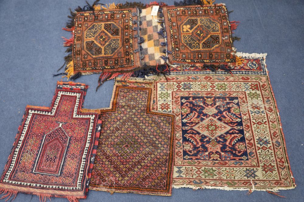 Two Afghan salt bags, a similar saddle bag and a Caucasian rug (4)